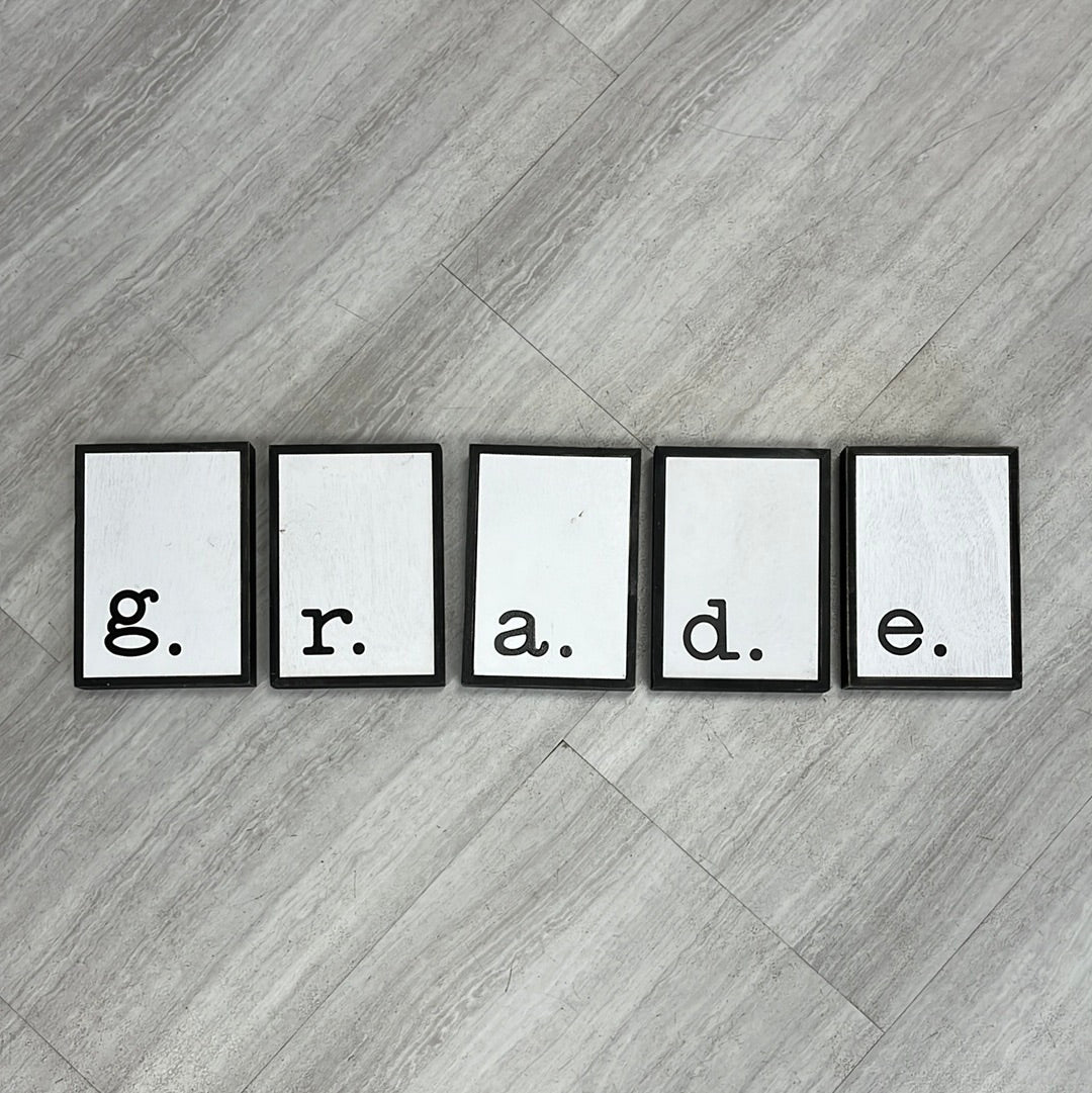 G. R. A. D. E. box Signs